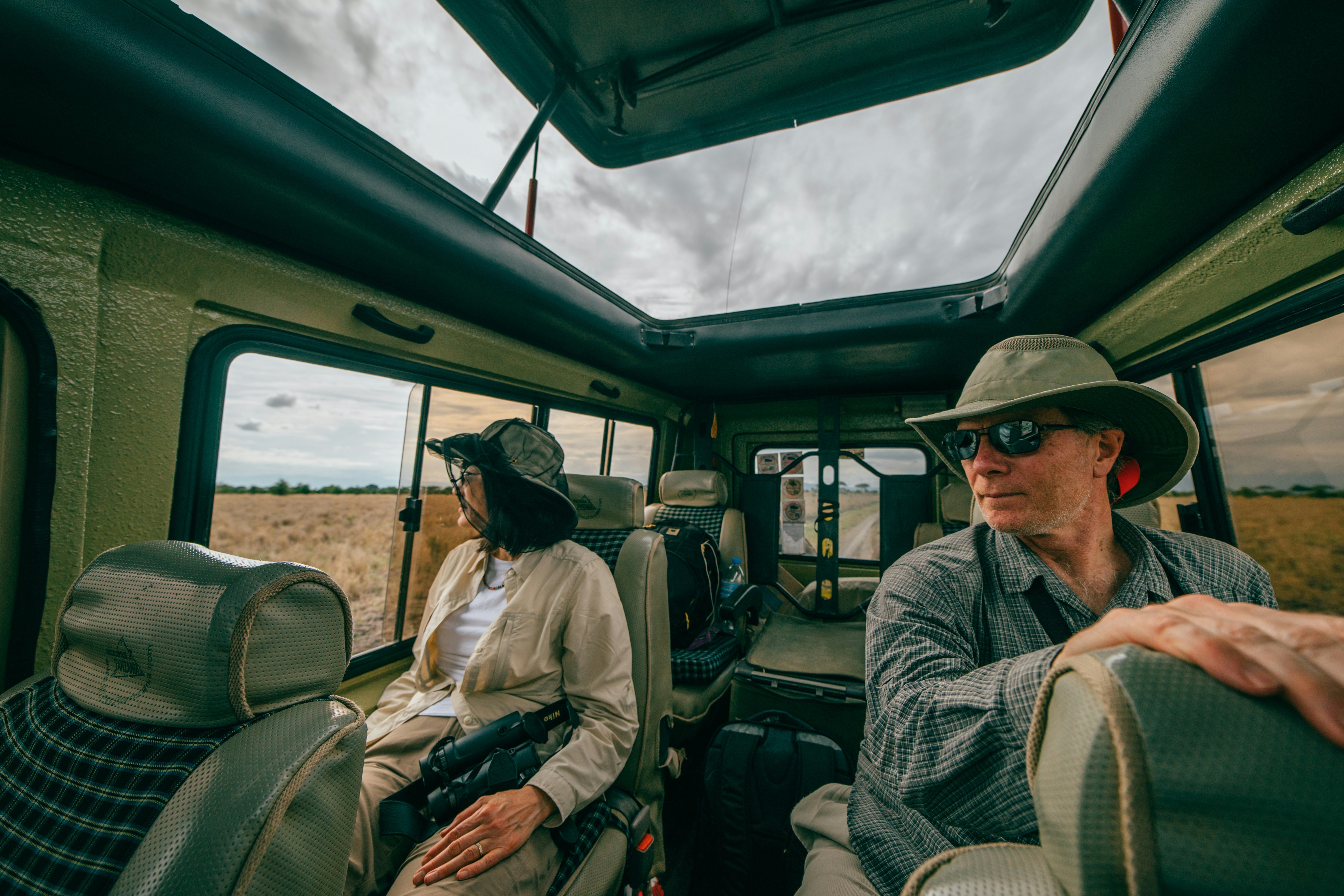 man and woman sitting inside car